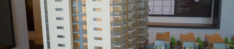 Model of a concrete condominium building called James.